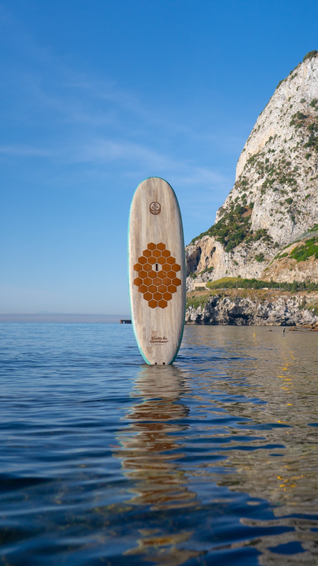 The Agave 10 standing upright in the shallows beneath the cliffs of Gibraltar